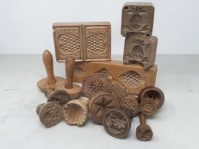A collection of treen Butter Prints with various designs including one with a fox and the words '