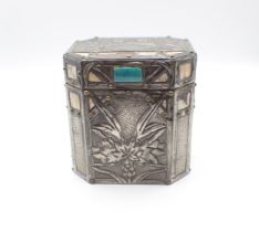 An Arts and Crafts octagonal pewter Tea Caddy embossed flowers with mother of pearl inlay, 4 1/2in x