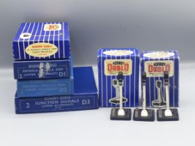 Hornby Dublo five colour light Signals and four boxes of manual Signals, excellent to mint, boxed.