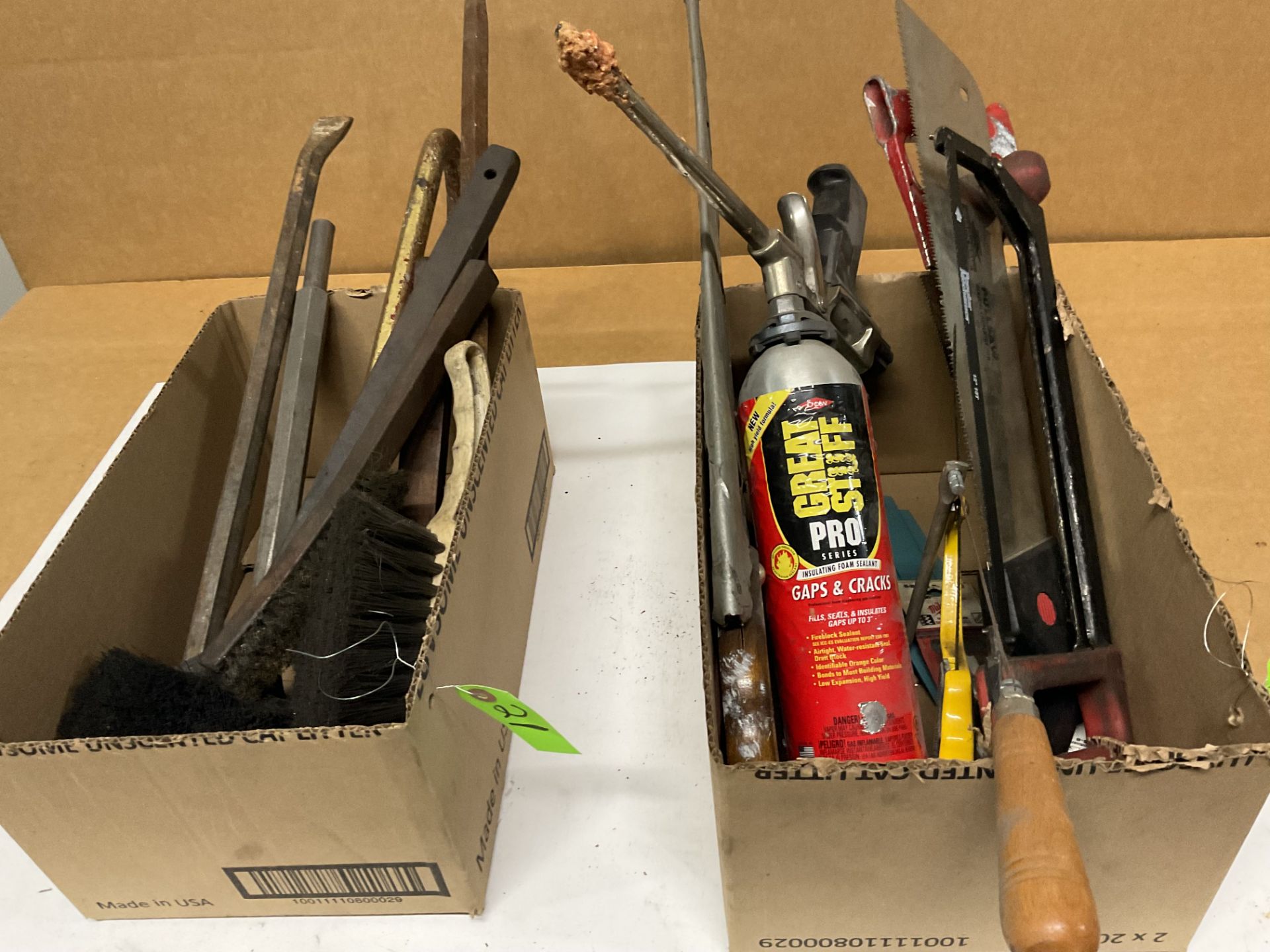 Assortment of pry bars , brushes, various hand saws and blades