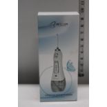 A boxed cordless water flosser