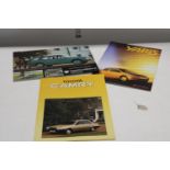 Three pieces of vintage Toyota advertising brochures