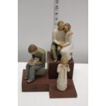 A set of three Willow Tree figurines on stand