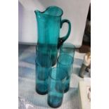 A set of five stylish green glasses with matching jug. Jug is 26cm tall.