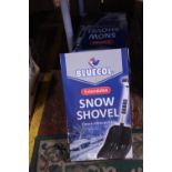 Four boxed snow shovels