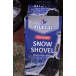 Four boxed new snow shovels