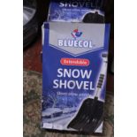 Four boxed new snow shovels