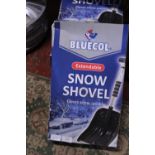 Four boxed new snow shovels