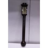 A Georgian style stick barometer. small chip to top of wooden case. Postage unavailable