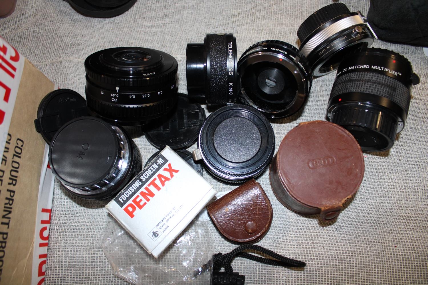 A selection of assorted camera lenses and filters