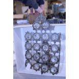 A vintage metal and glass wall light