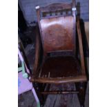 A antique wooden rocking chair with poker work back and seat a/f. Postage unavailable