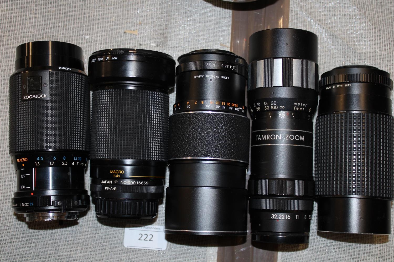 Five assorted camera lenses