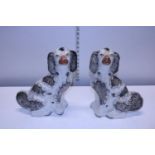 A pair of antique Staffordshire flatback Spaniels