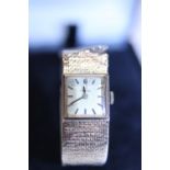 A ladies 9ct Omega wrist watch with working movement (damage to strap) gross weight 31g