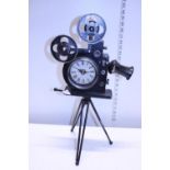 A novelty clock in the form of a vintage projector