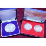 A cased Churchill crown & J F Kennedy commemorative coin set