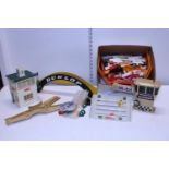 A box of vintage Scalextric accessories