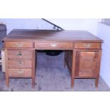 A large oak partners desk with brass fittings. Postage unavailable. 152cm x 106cm x 83cm