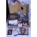 A job lot of vintage 7" singles, cassettes and books etc