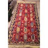 A large hand woven Persian rug approximately 200cm x 82cm