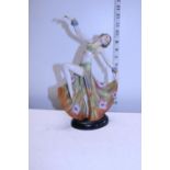 A Art Deco style ceramic figure (one finger damaged)