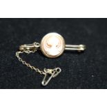 A vintage 9ct gold cameo bar brooch with safety chain gross weight 2.97g