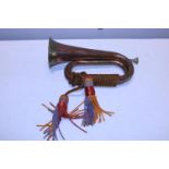 A vintage copper and brass bugle