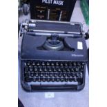 A vintage Olympia Deluxe typewriter. postage unavailable.