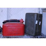 A vintage metal petrol can and a metal tin. postage unavailable.
