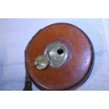 A vintage Chesterman leather cased tape measure