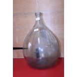 A glass carboy. postage unavailable.