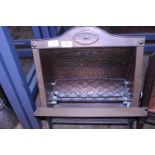 A vintage copper bodied electric fire. postage unavailable.