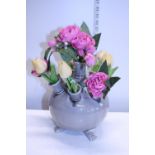 A ceramic posy holder