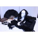 A selection of assorted Edwardian clothing including a ostrich feather fan