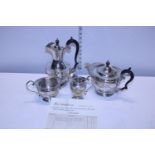 A four piece sterling silver tea set; compromising of teapot, hot water jug, sugar and cream