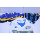 Two Leeds Rhinos Rugby shirts and a Leeds United Football shirt