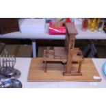 A vintage handmade wooden printing press model