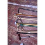 A selection of assorted vintage walking sticks including a bone handle example. Shipping unavailable