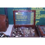 A display case full of collectable souvenir spoons