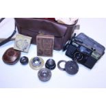 A job lot of assorted camera accessories and lenses including a wollensak lens