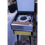 A vintage Phillips record player on stand, 77cm tall postage unavailable