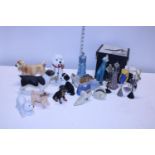 A job lot of assorted ceramic figures including dogs and mannequins