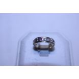 A 9ct gold and silver Ruby and white stones full eternity ring size L 1/2