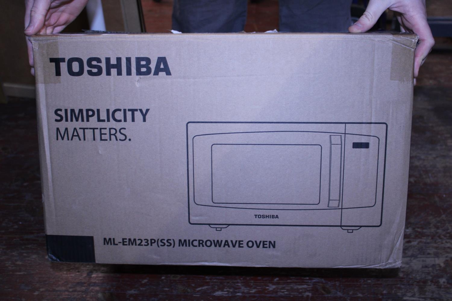 A new boxed Toshiba microwave oven, postage unavailable