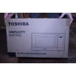 A new boxed Toshiba microwave oven, postage unavailable