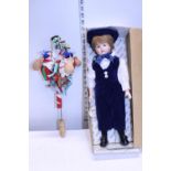 A vintage Alberon doll and a continental child's toy