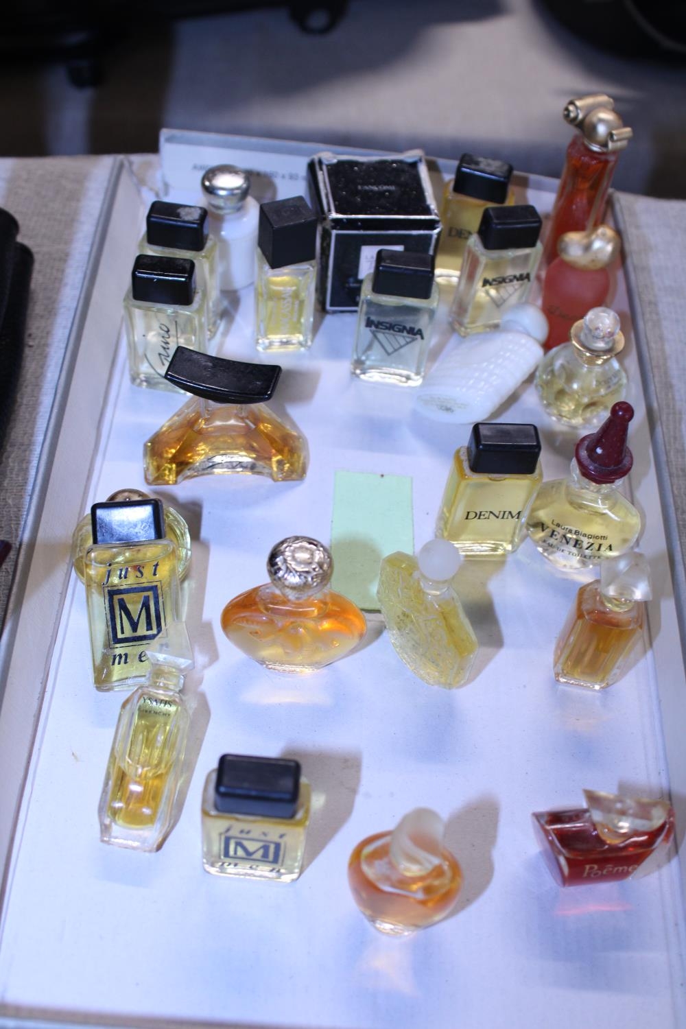 A job lot of assorted miniature perfumes