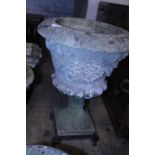 A larger stone planter on stand, postage unavailable