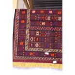 A small hand woven Persian rug approximately 115cm x 90cm